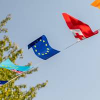 Flag banner and clock tower in background